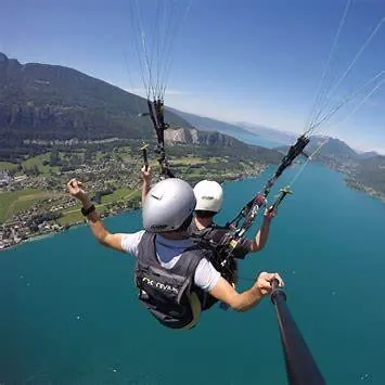 Tandem paragliding flight above Lake Annecy