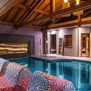 Indoor pool in a wood-panelled spa
